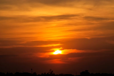 Low angle view of dramatic sky during sunset