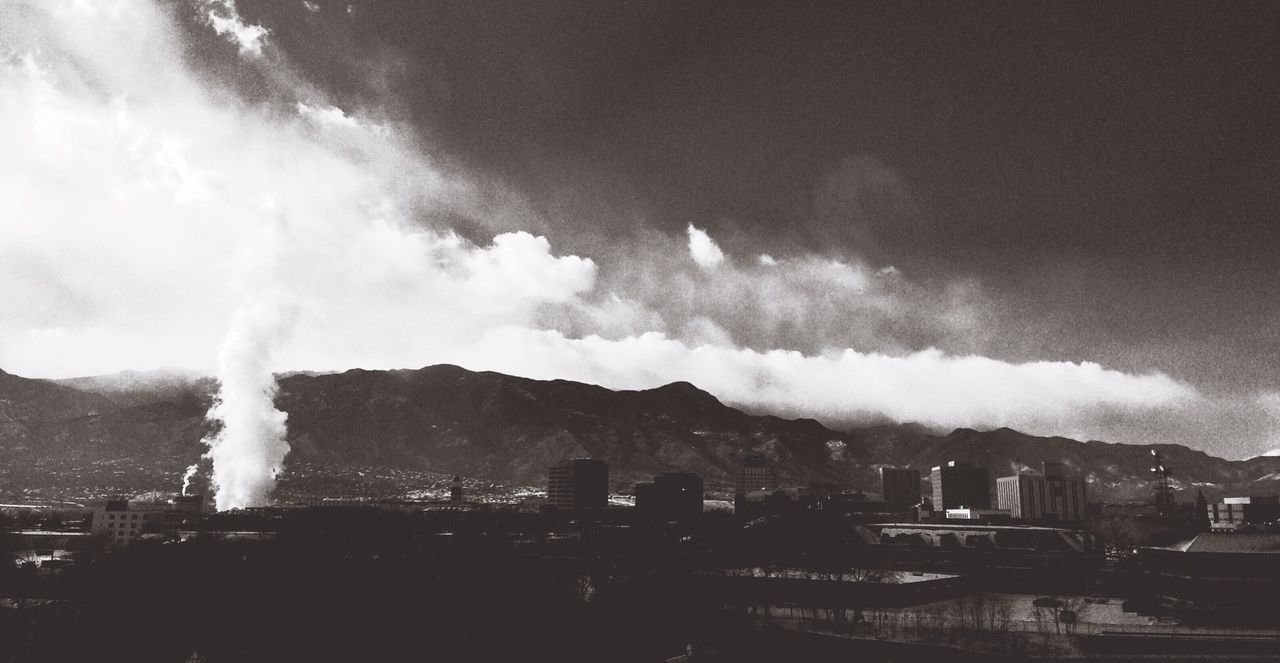 sky, cloud - sky, building exterior, architecture, built structure, cloudy, mountain, cityscape, weather, city, cloud, scenics, nature, landscape, beauty in nature, residential building, residential district, outdoors, storm cloud, mountain range