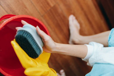 Midsection of woman holding equipment