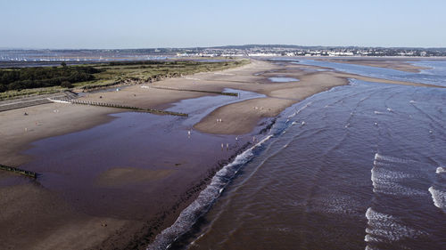 Aerial view of beach against clear sky
