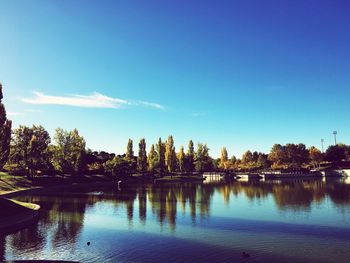 Scenic view of lake against blue sky