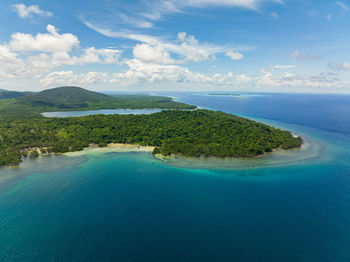 Aerial drone of balabac island with tropical forest and blue sea. palawan. philippines.