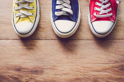 Directly above shot of shoes on wooden table