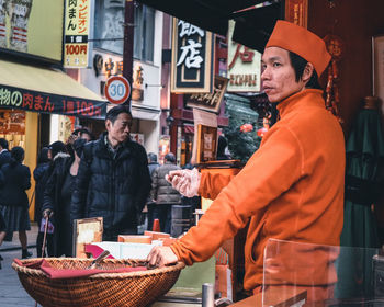 People standing at market stall