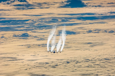 Aerial view of aircraft overhead closed layer of clouds