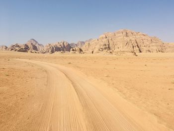 Scenic view of desert against clear sky