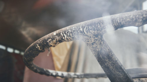 Close-up of rusty statue against blurred background