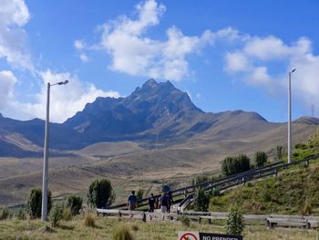 Scenic view of mountain against cloudy sky