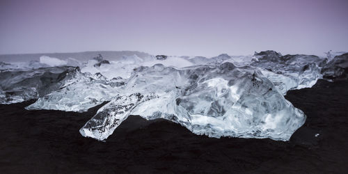 Scenic view of snow covered land