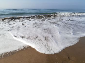 Scenic view of beach against sky