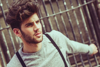 Portrait of young man sitting outdoors