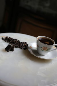 Close-up of coffee cup on table