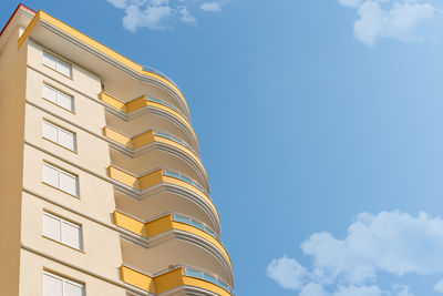 Low angle view of an apartment building with balconies. residential real estate.