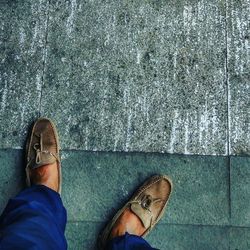 Low section of woman standing on ground