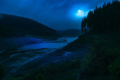 Scenic view of sea against sky at night