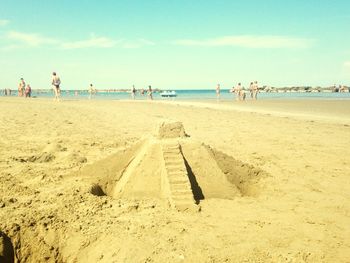 Rear view of people on beach