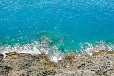 High angle view of sea seen through rocks