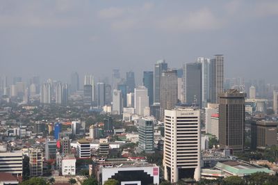 Modern buildings in city against sky