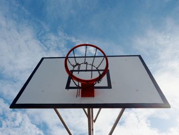 Baskerball hoop. worn out basketball hoop on basketball court under sky