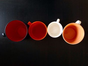 Directly above shot of tea cup against black background