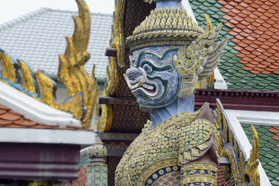 Low angle view of guardian statue at wat phra kaeo