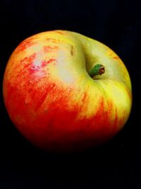 Close-up of apple over white background