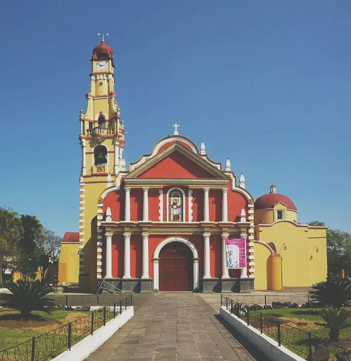 architecture, building exterior, built structure, place of worship, religion, church, clear sky, spirituality, blue, the way forward, house, outdoors, sky, facade, day, no people, cross, copy space