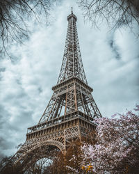 Low angle view of eiffel tower on a cloudy day in spring 