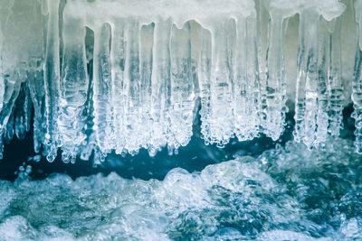 Close-up of icicles in sea during winter