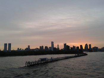 City skyline against sky during sunset