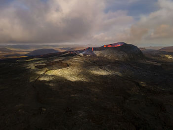 Scenic view of mountains against sky during sunset