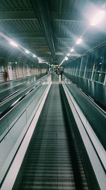 Low angle view of illuminated subway station