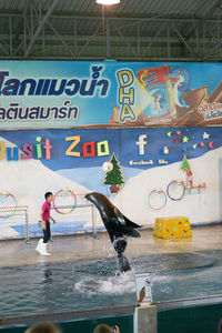 People on wet swimming pool