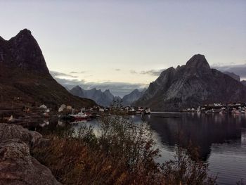 Scenic view of lake and mountains against sky