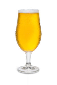 Close-up of beer glass against white background