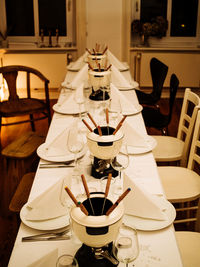 Close-up of chairs on table