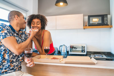 Couple having pizza at home