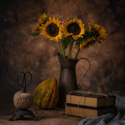 Close-up of yellow flowers in vase