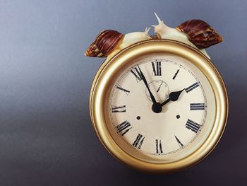 Close-up of clock on table