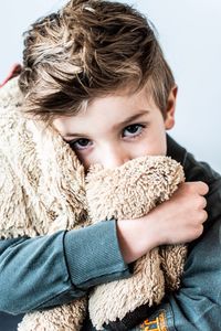 Portrait of boy with toy in winter