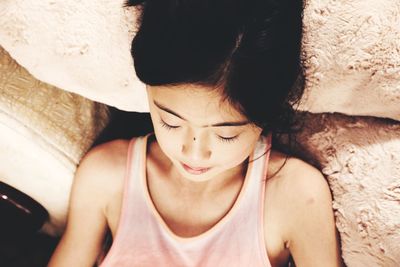 Close-up of girl relaxing on sofa