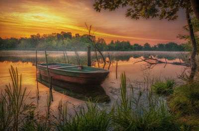 Scenic view of lake against sky during sunset