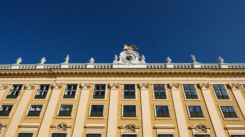 Low angle view of building against blue sky