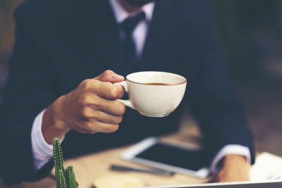 Man holding coffee cup