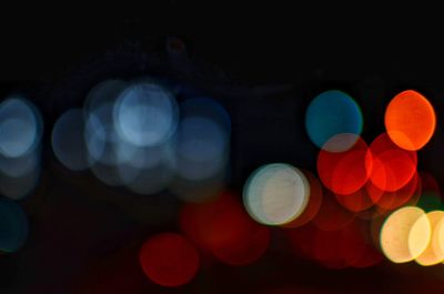 Defocused image of illuminated lights at night