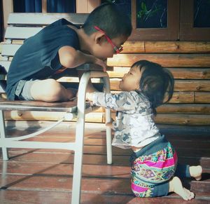 Cute siblings playing at porch