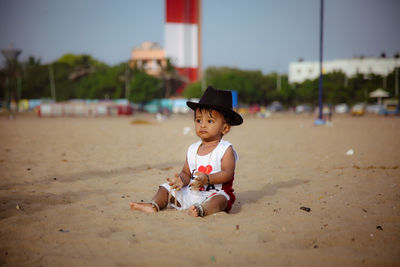 Baby sitting on the sand 