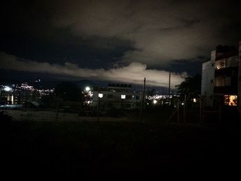 Storm clouds over city at night