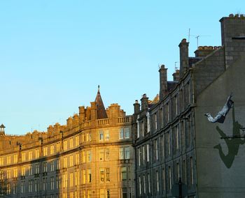 Low angle view of buildings against clear sky