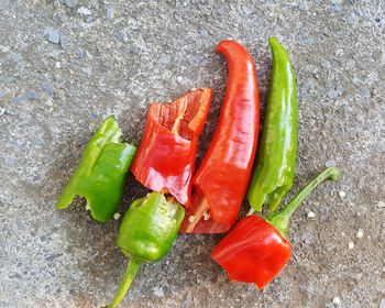 High angle view of multi colored chili peppers